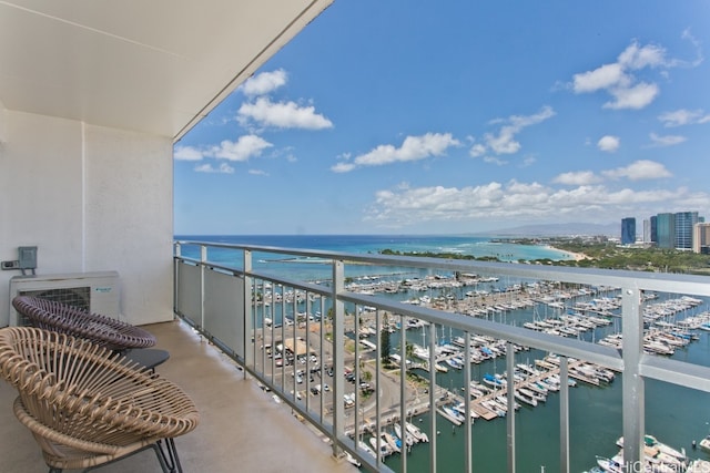 balcony featuring a water view