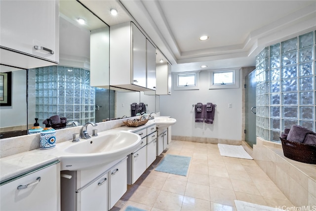 bathroom featuring vanity, tile patterned floors, a raised ceiling, and an enclosed shower