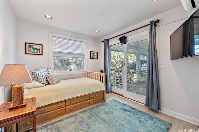 bedroom with light hardwood / wood-style flooring and access to exterior