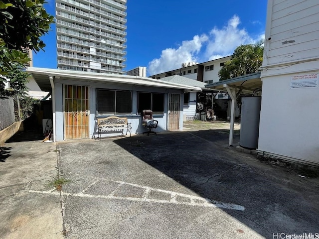 view of patio / terrace featuring grilling area and gas water heater