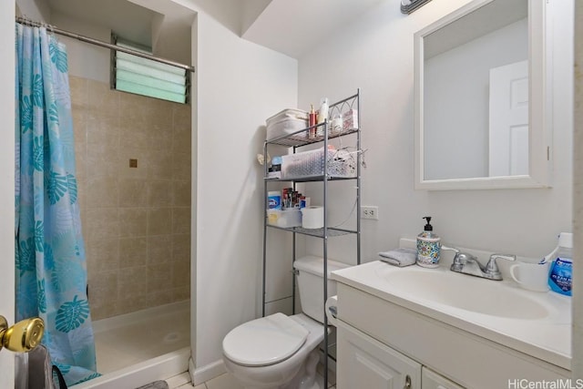 bathroom featuring tile patterned flooring, toilet, vanity, and walk in shower