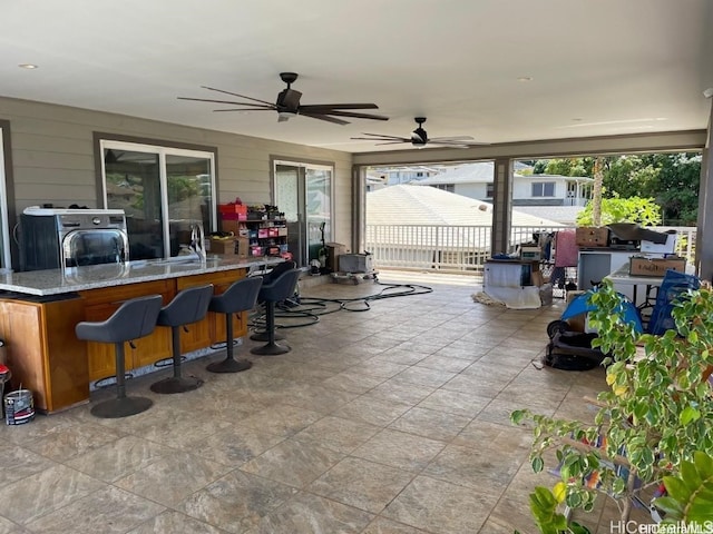 view of patio featuring sink and ceiling fan