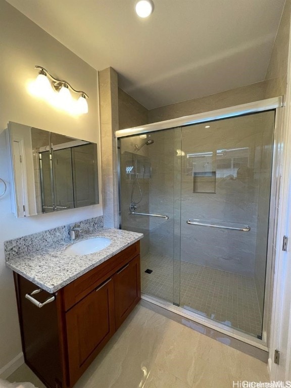 bathroom featuring vanity and walk in shower