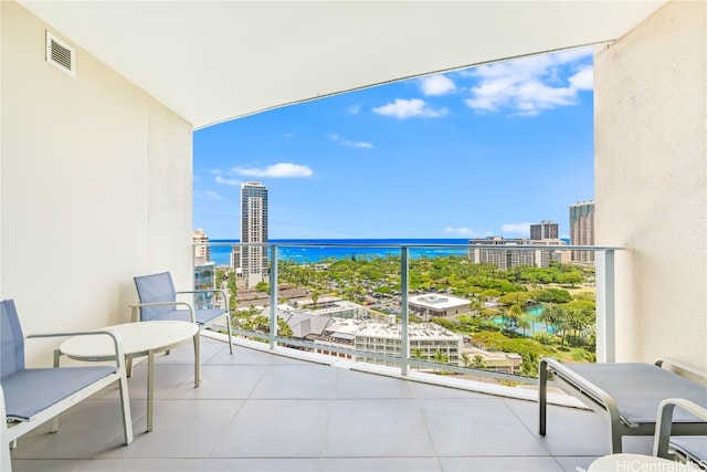 balcony featuring a water view