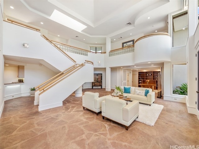 living room featuring a high ceiling and light colored carpet