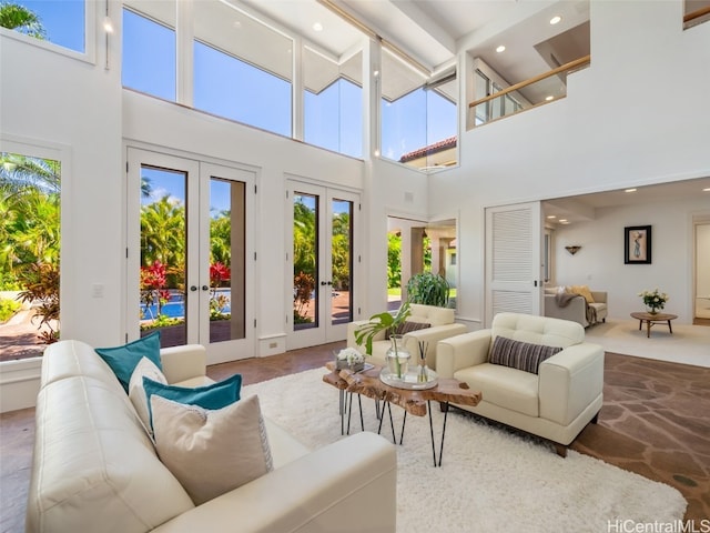 sunroom / solarium featuring french doors and beam ceiling