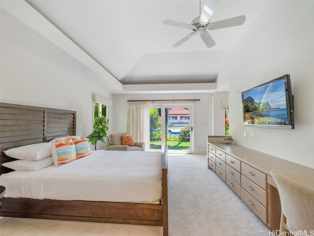 carpeted bedroom with built in desk, access to exterior, high vaulted ceiling, and ceiling fan