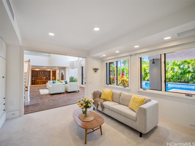 living room featuring light carpet