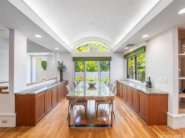 dining space featuring light hardwood / wood-style floors and a wealth of natural light