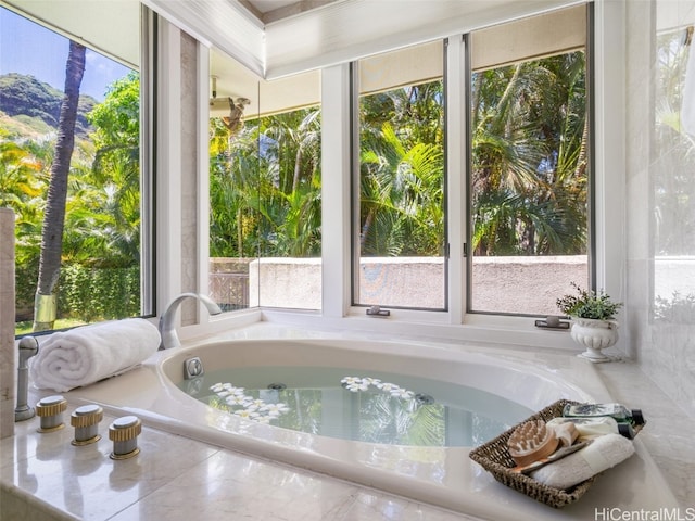 unfurnished sunroom with a jacuzzi