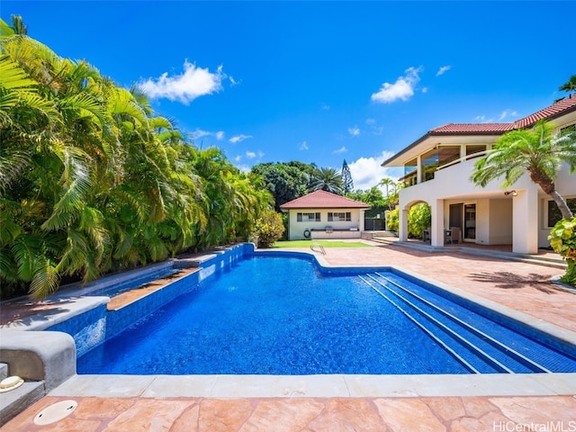 view of swimming pool with a patio area