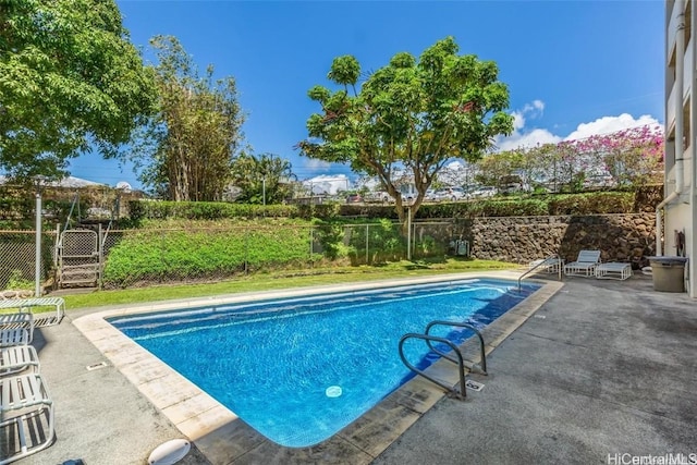 view of swimming pool with a patio area, a fenced backyard, and a fenced in pool