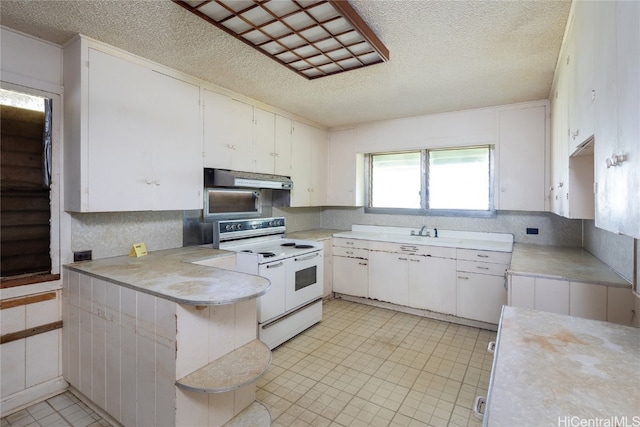 kitchen featuring ventilation hood, electric range, a textured ceiling, and white cabinets