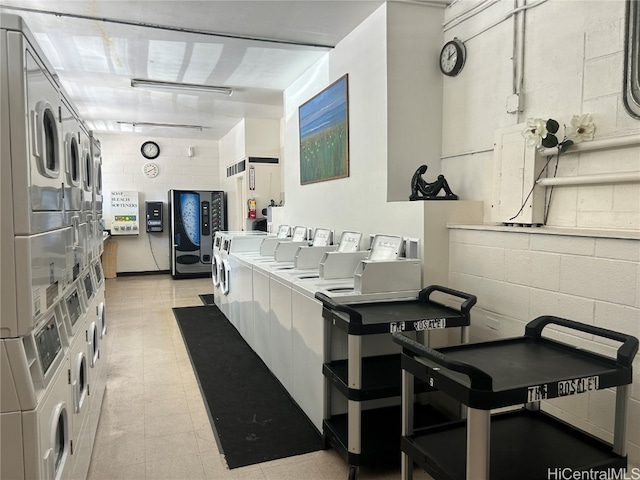 kitchen featuring tile counters, stacked washer and dryer, and washing machine and dryer