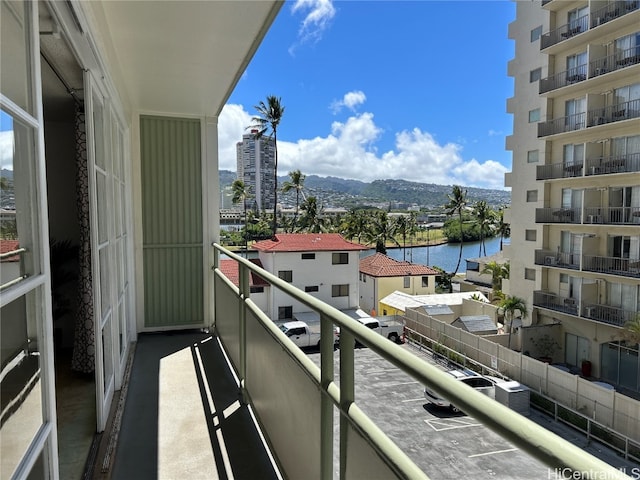 balcony with a water and mountain view