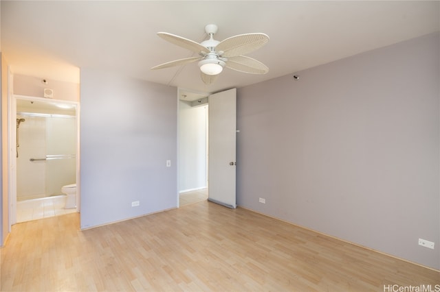 empty room featuring light wood-type flooring and ceiling fan