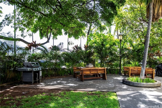 view of home's community with a patio area