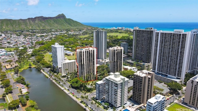 aerial view featuring a water and mountain view