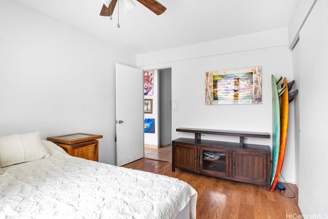 bedroom featuring hardwood / wood-style flooring and ceiling fan