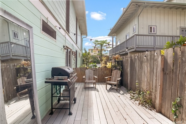 wooden deck with grilling area