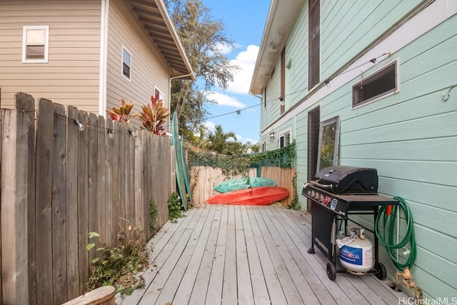 deck featuring a grill