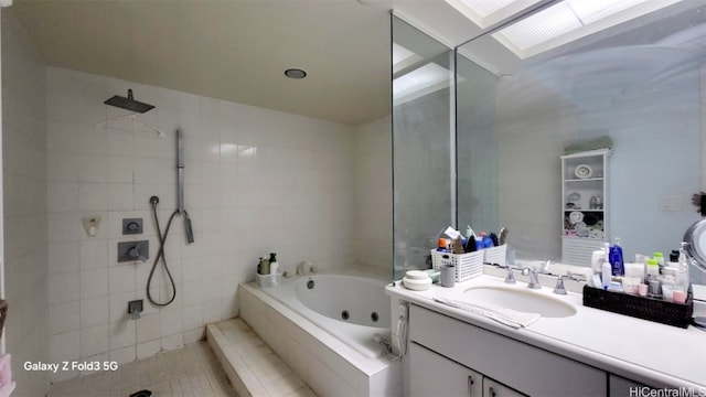 bathroom with vanity, plus walk in shower, a skylight, and tile patterned flooring