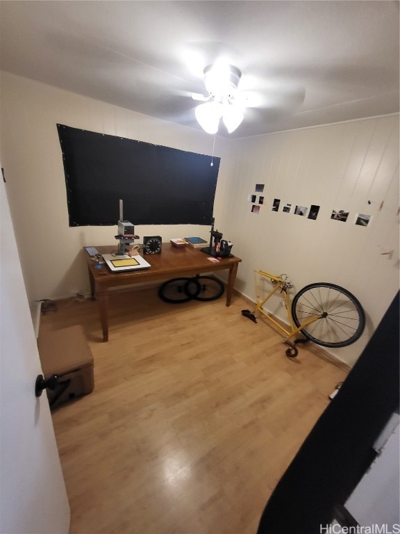 interior space with ceiling fan and hardwood / wood-style flooring