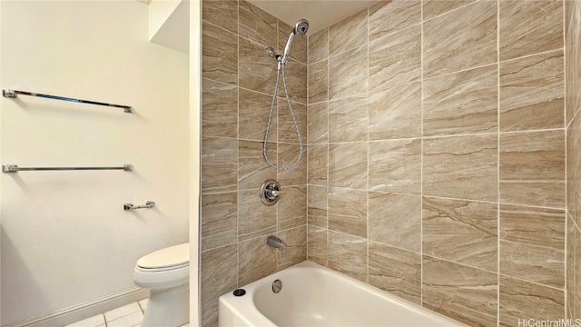 bathroom with tiled shower / bath, toilet, and tile patterned flooring