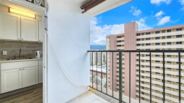 balcony with sink and a mountain view