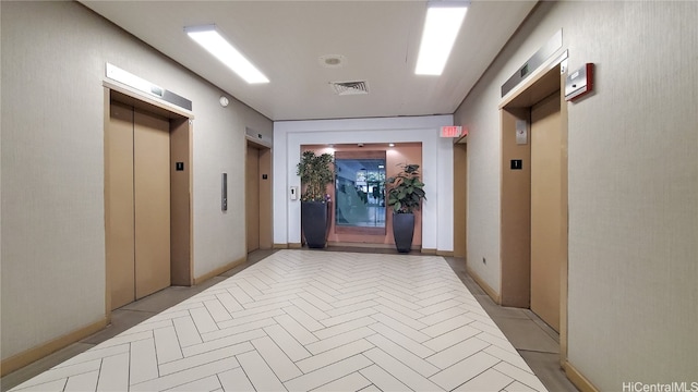 hallway featuring elevator