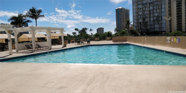 view of pool featuring a patio area and a pergola