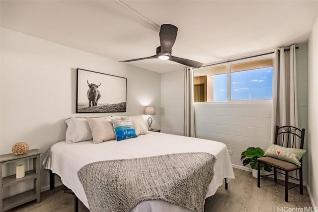 bedroom featuring ceiling fan and wood finished floors