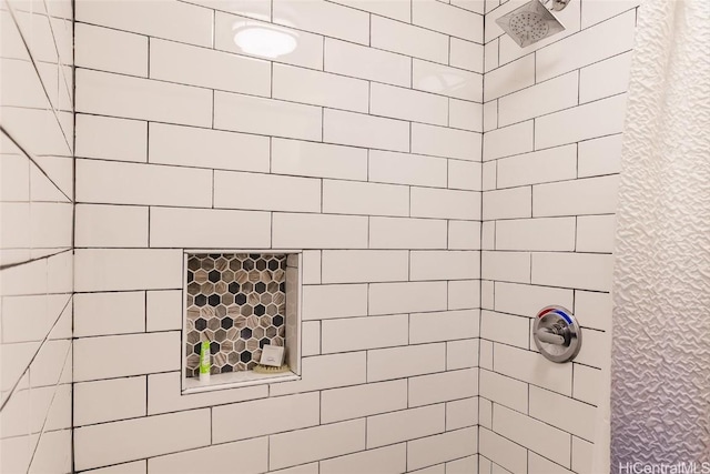 bathroom with tiled shower