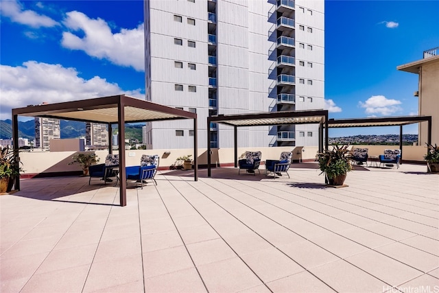 exterior space featuring outdoor lounge area and a pergola