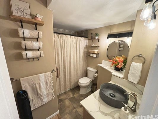 bathroom with vanity, toilet, and a shower with shower curtain