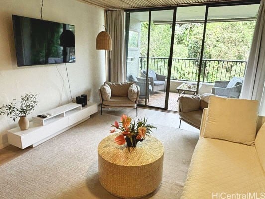 living room with a wealth of natural light and expansive windows