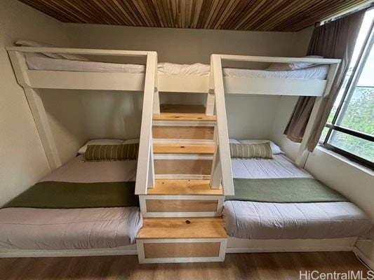 unfurnished bedroom featuring hardwood / wood-style flooring