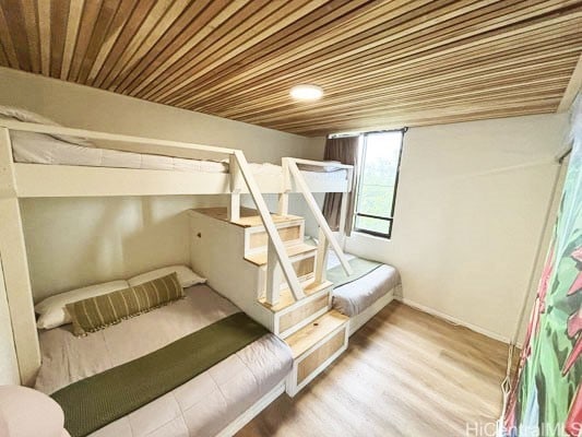 unfurnished bedroom featuring hardwood / wood-style flooring