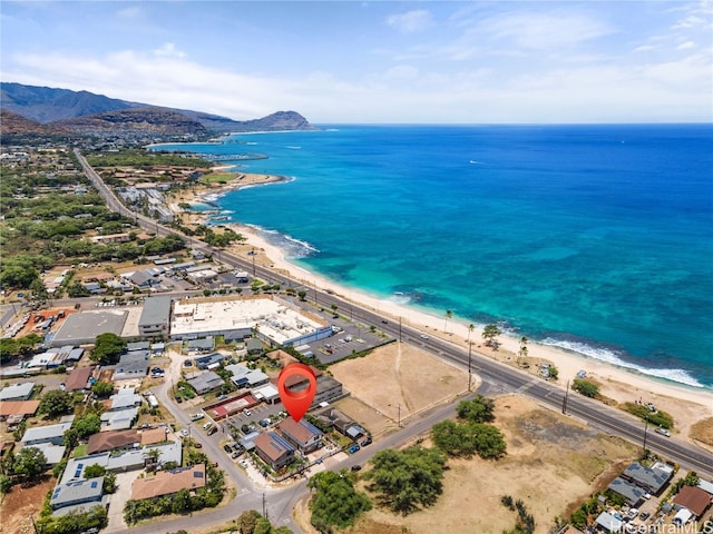 bird's eye view featuring a water and mountain view and a beach view