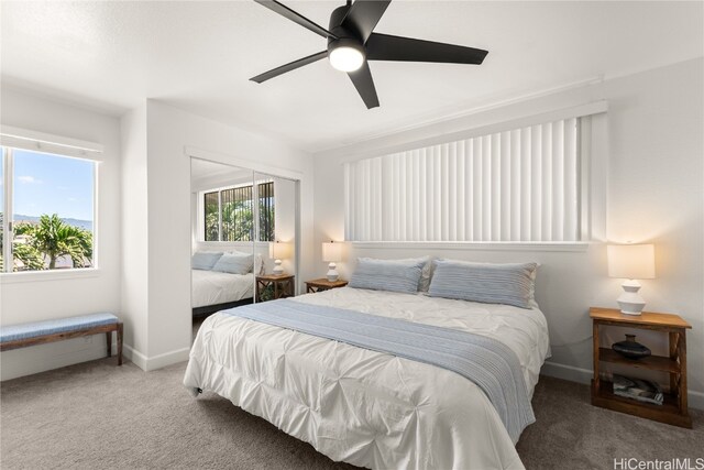 carpeted bedroom with ceiling fan