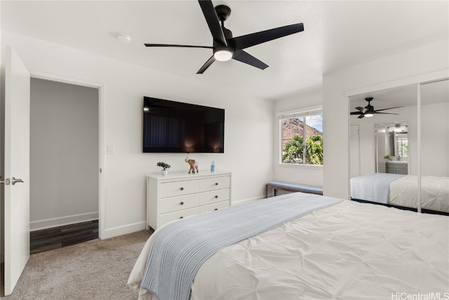 bedroom featuring light colored carpet and ceiling fan