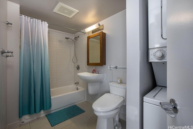 bathroom featuring toilet, shower / bathtub combination with curtain, and tile patterned flooring