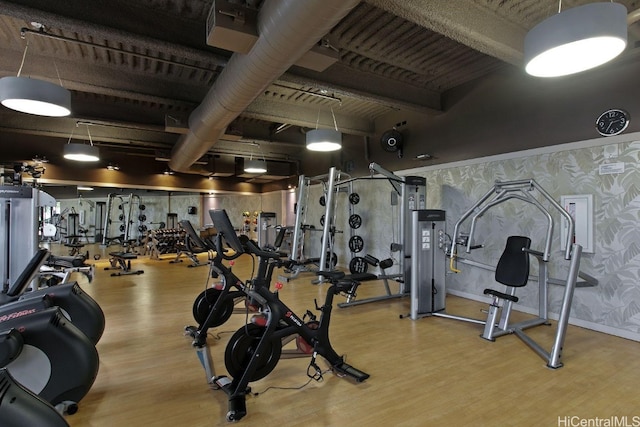 workout area featuring light wood-type flooring