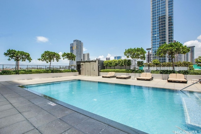 view of swimming pool with a patio area