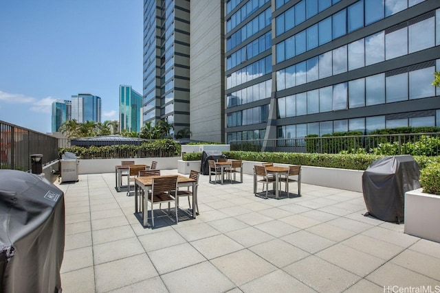 view of patio featuring a grill