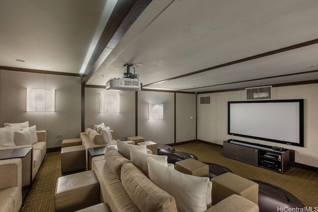 home theater room with dark carpet and beamed ceiling