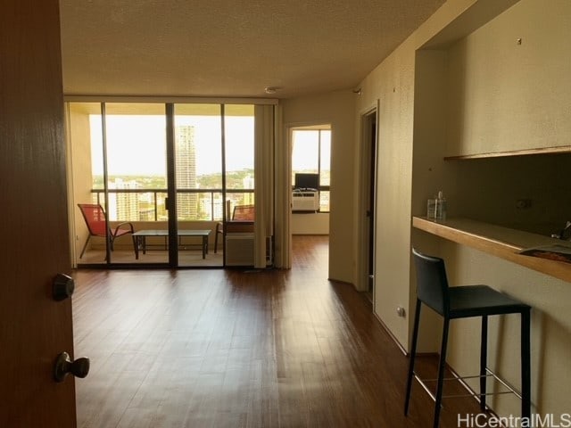 empty room with dark wood-type flooring