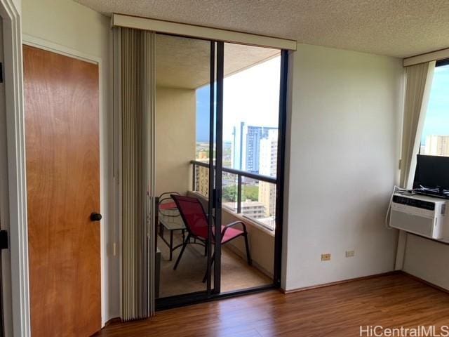 5333 Likini St Unit 2103, Honolulu, HI 96818 - dining space with healthy amount of natural light, floor to ceiling windows, wood finished floors, and a textured ceiling