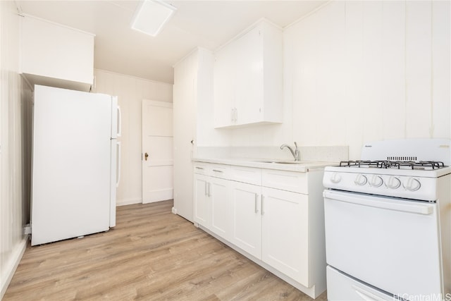 kitchen featuring light hardwood / wood-style flooring, white cabinetry, sink, and white appliances