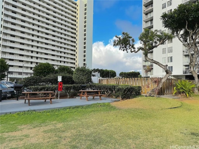 surrounding community featuring a yard and fence